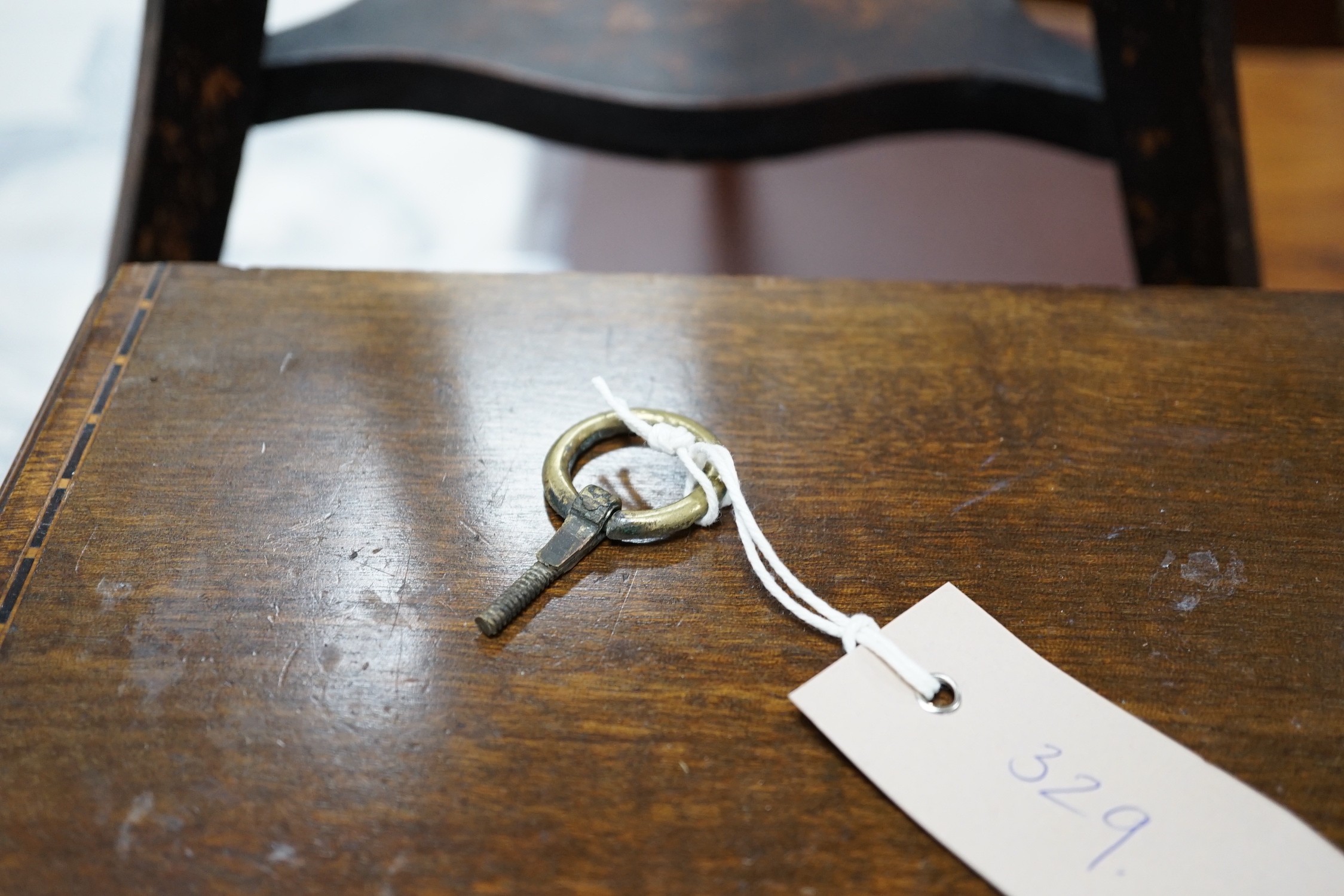 An Edwardian ebonised jardiniere stand with brass liner, width 46cm, depth 46cm, height 85cm, and a miniature two drawer chest *Please note the sale commences at 9am.
